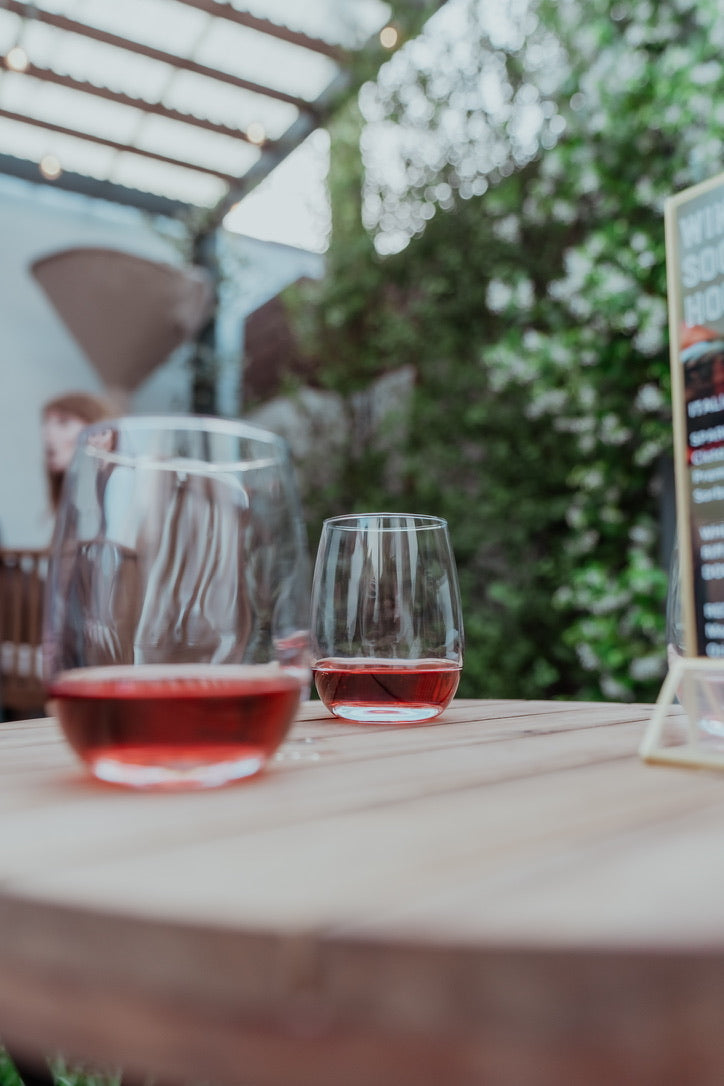 Wine glasses on table with red wine